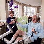 Nancy Ryan, Edgewood's Wellness Specialist and event organizer shows Mr. Dick Judge how to use the Nu-Step equipment during The Longest Day fundraiser for the Alzheimer's Association. 
