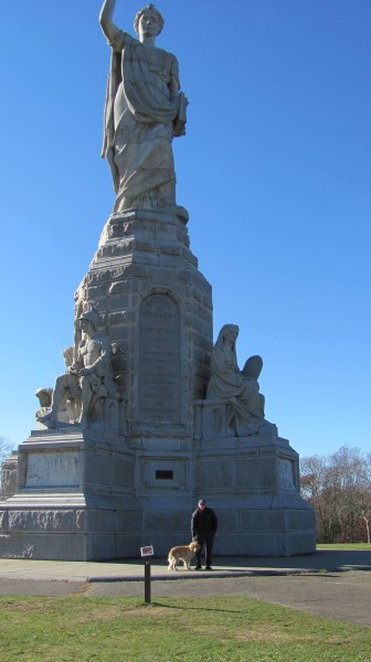 : Steve Dubin, a spokesperson for the Plymouth Turkey Trot and Thanksgiving Day Pilgrim 5k Run and Walk, poses in front of the National Monument to the Forefathers. At 81 feet high, it is thought to be the world's largest solid granite monument, and is one stop along the five mile Plymouth Turkey Trot, which takes place on Thanksgiving morning starting at Plymouth Rock.