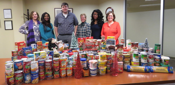 OCES  staff Rose Lynch, Tremeda Martin, Charlie Mills, Kerry Phelan, Vicky Rateau and Cathy Whitney organize food donations for distribution. 