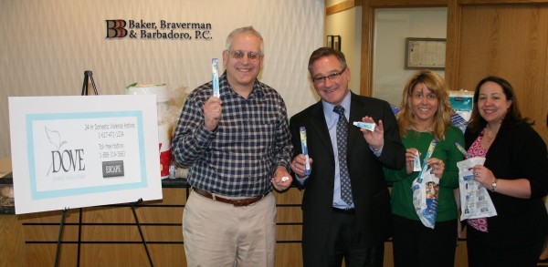 Dr. Richard Wolfert “The Toothboss” donates 144 toothbrush kits to Baker, Braverman & Barbadoro, P.C.’s drive to benefit DOVE, a non-profit that supports victims of domestic violence. (l-r) Dr. Wolfert, Jonathan Braverman, Lisa Kenepp and Theresa Barbadoro of Baker, Braverman & Barbadoro, P.C. 
